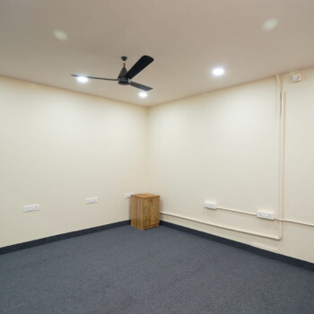 Modern coworking workspace with desks and meeting rooms for Office space rentals in Kochi