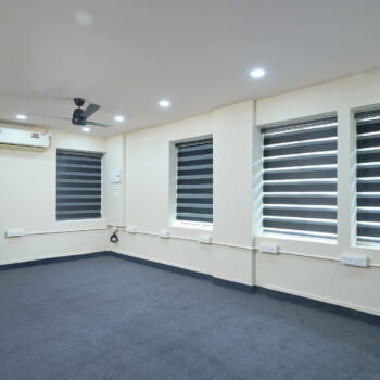 Well-lit coworking area suitable for companies operating in Ernakulam